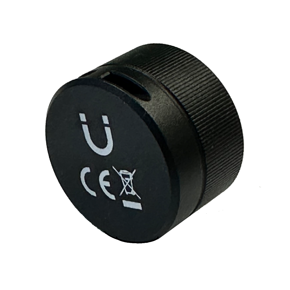 Eine kleine, runde schwarze elektronische Komponente mit strukturierter Kante, einem U-förmigen Symbol und einer CE-Kennzeichnung.